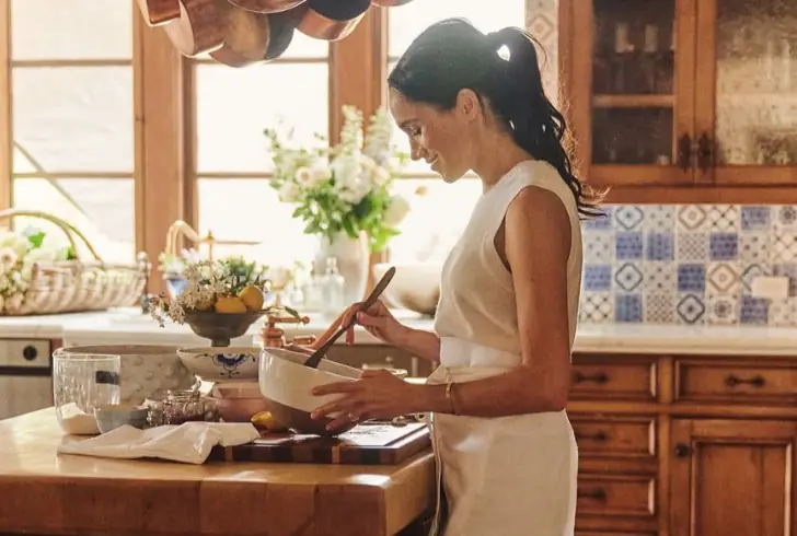 Meghan Markle cooking in kitchen scene