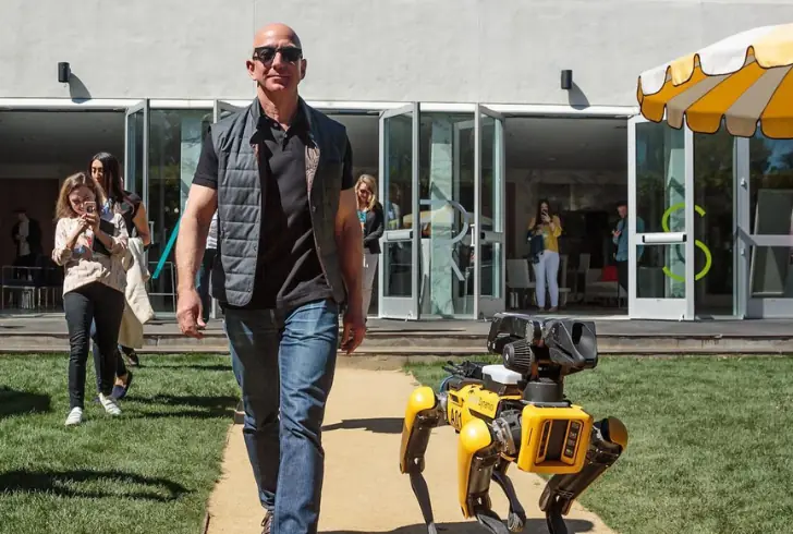 Jeff Bezos walking with robot dog